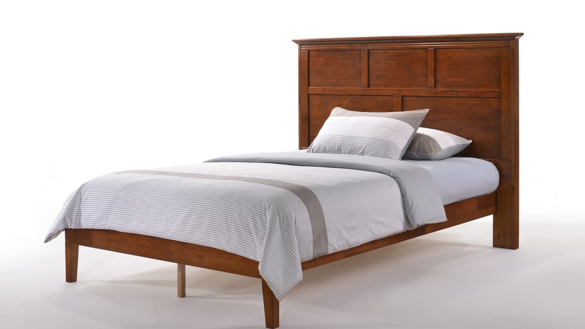 Hardwood platform bed in a calm bedroom with natural light